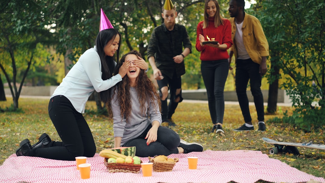 Friends celebrating with birthday cake